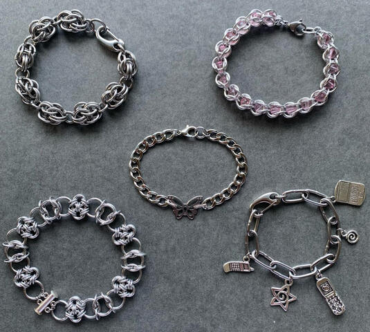 charm chain (stainless steel) 6.5”- $18-28 | top left chainmail (stainless steel) 8” - $30-40 | bottom left chainmail | (aluminum) 8.5” - $35-45 | butterfly 7.5” - $14-24 | pink bead 8” - $14-24